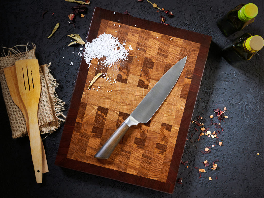 overhead view of cutting board with chef's knife