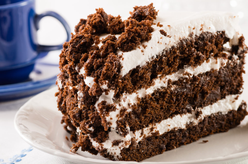 Chocolate crumb layer cake with white icing